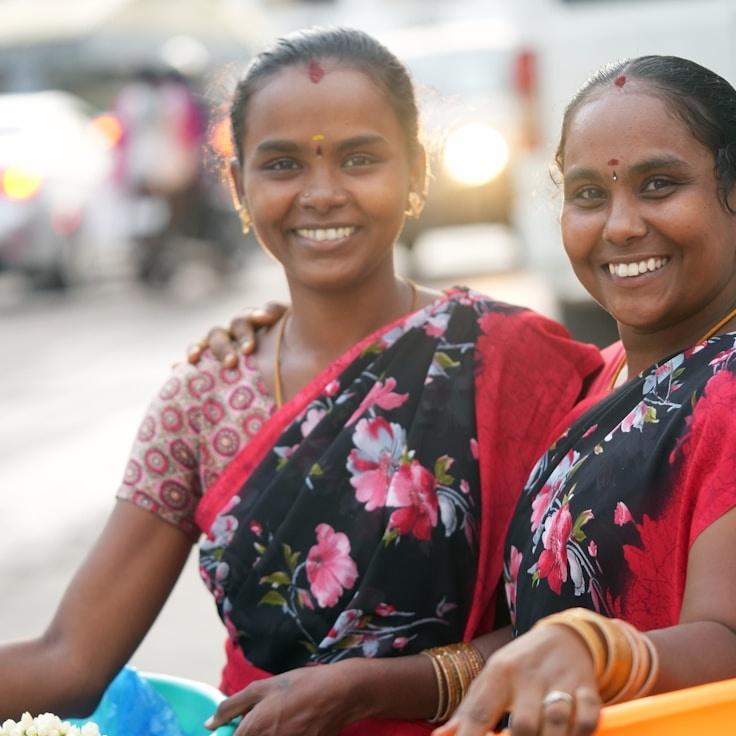 Alex Chen, Lead Design Curator at Stone Bridge Park, reviewing corporate floral arrangements